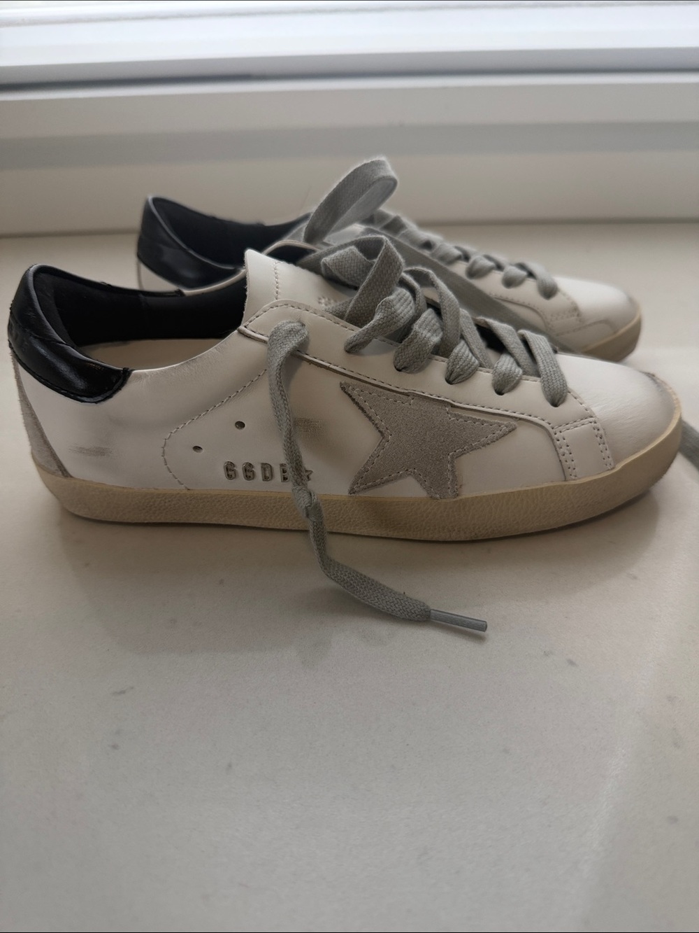 Super-Star with black heel tab and metal stud lettering